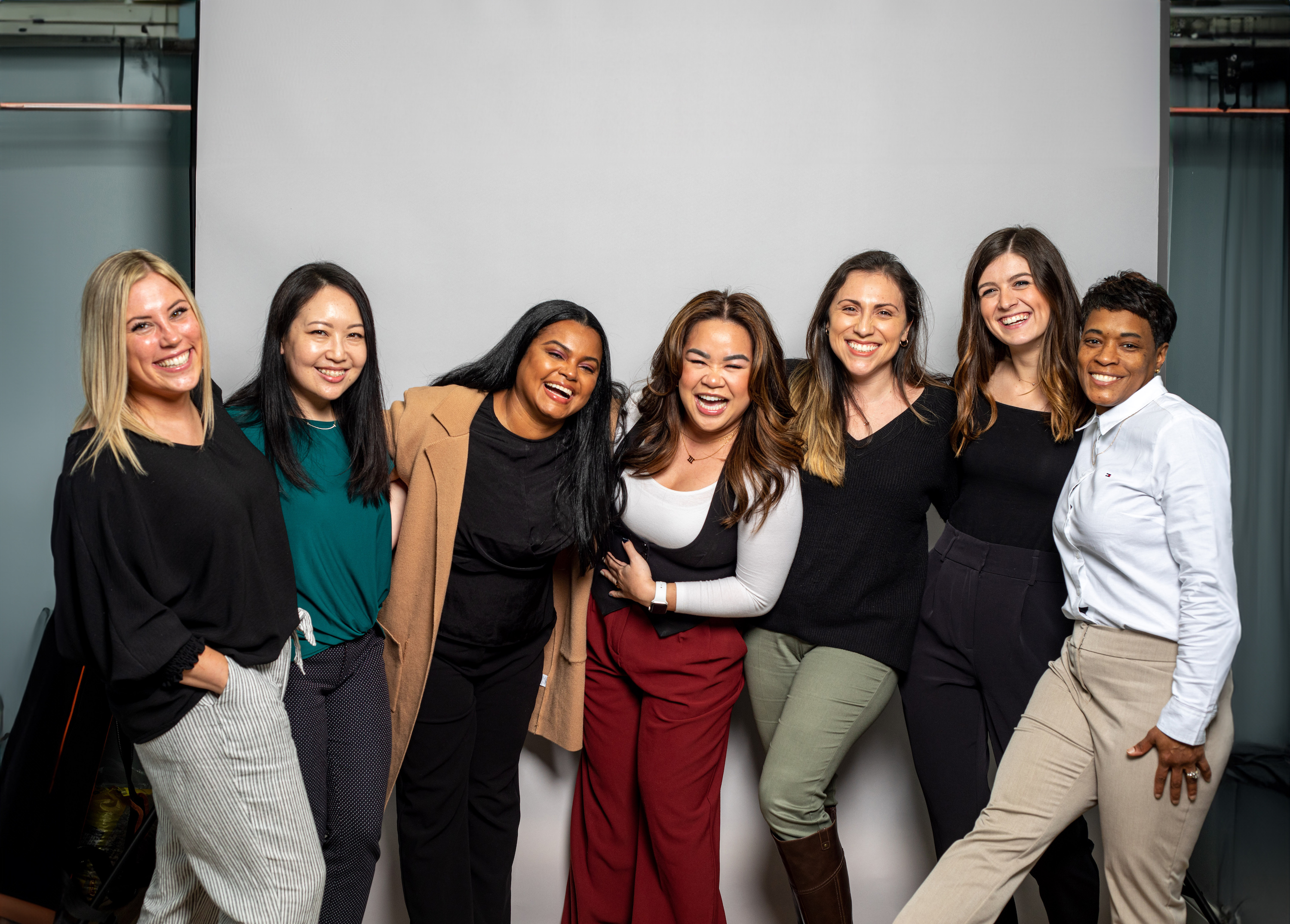 A group of team members smiling